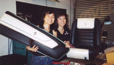 Melanie and Stacie Morimoto working in family upholstery shop